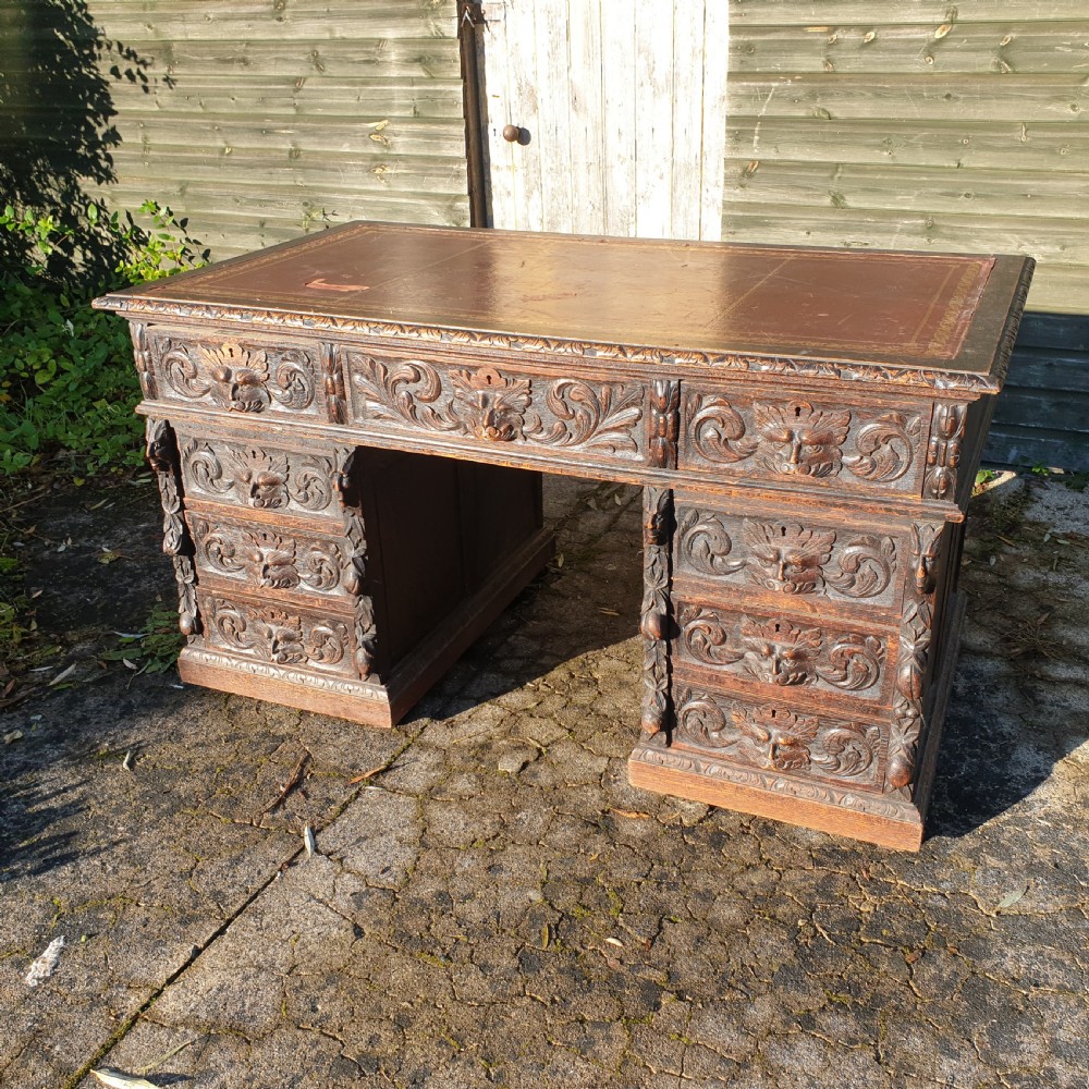 Victorian carved oak Green Man pedestal desk 