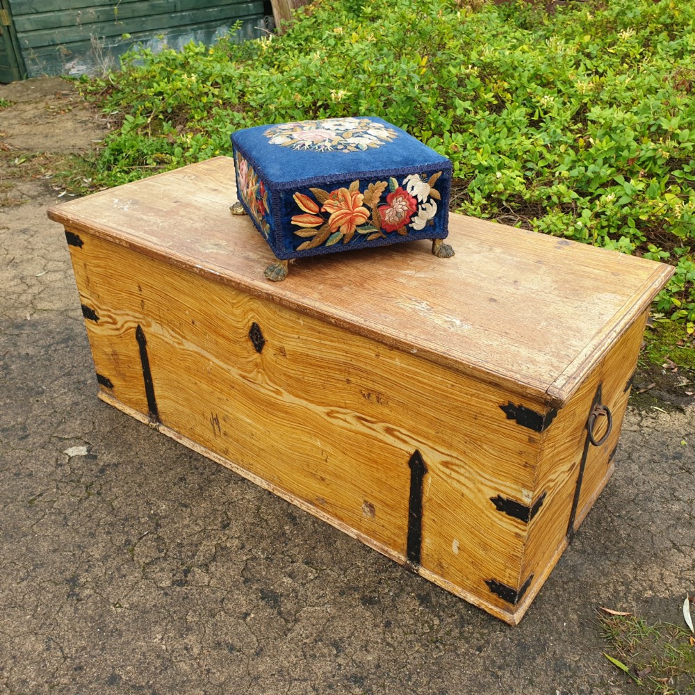 Crewel work foot stool with cast brass feet. View II