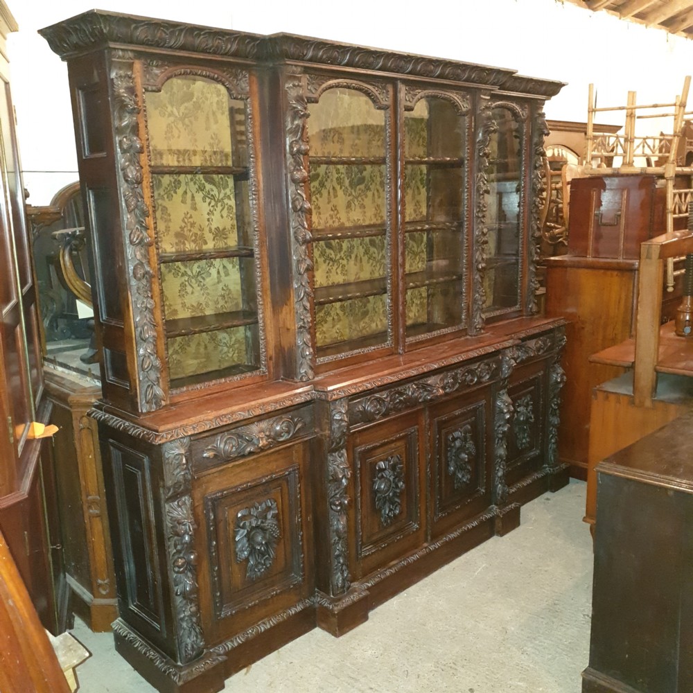 Good Victorian carved oak Green Man breakfront bookcase.  View II