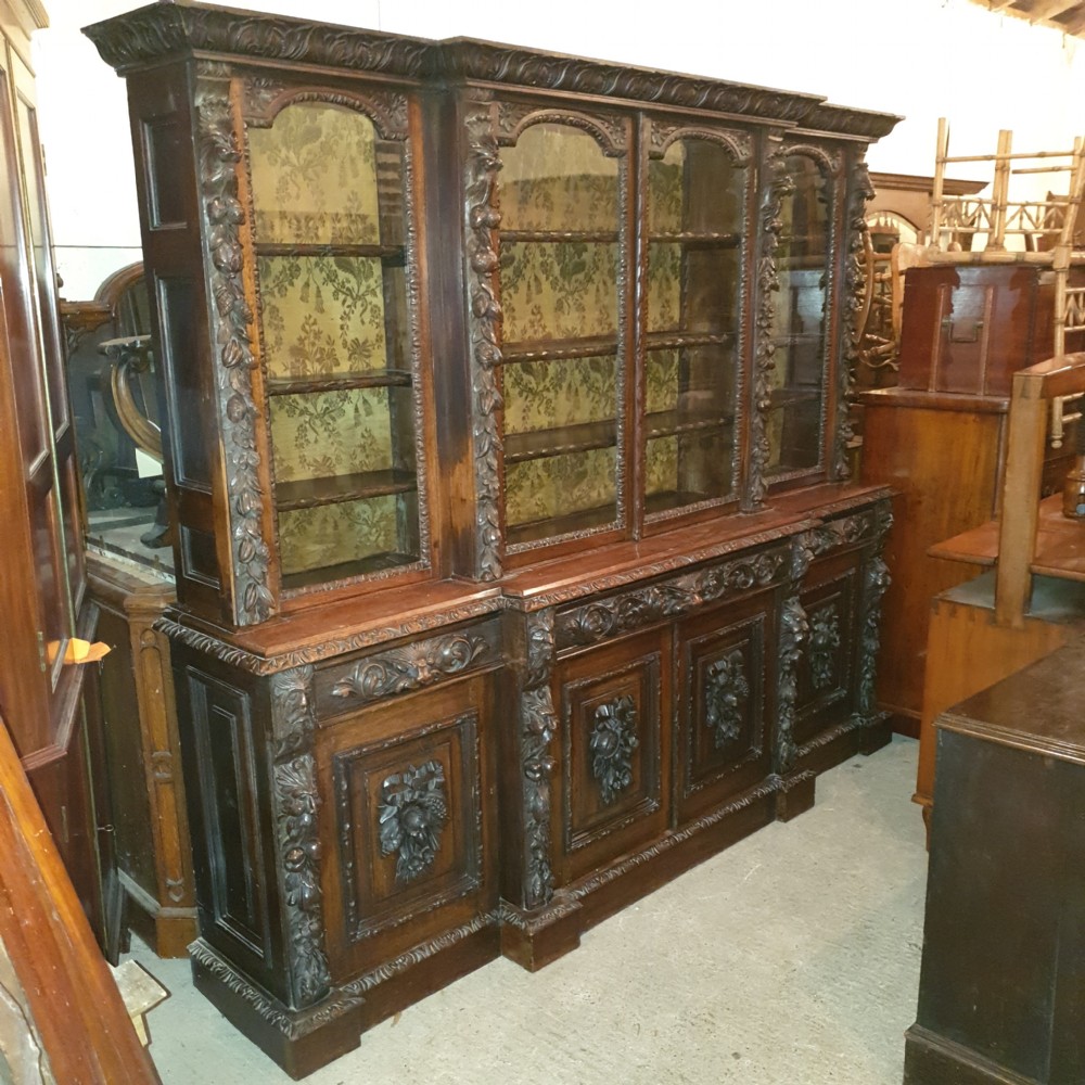 Good Victorian carved oak Green Man breakfront bookcase.  View III