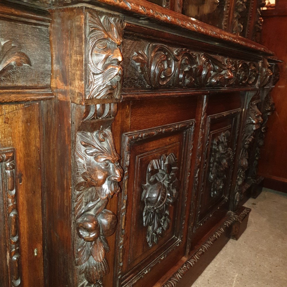Good Victorian carved oak Green Man breakfront bookcase.  View V