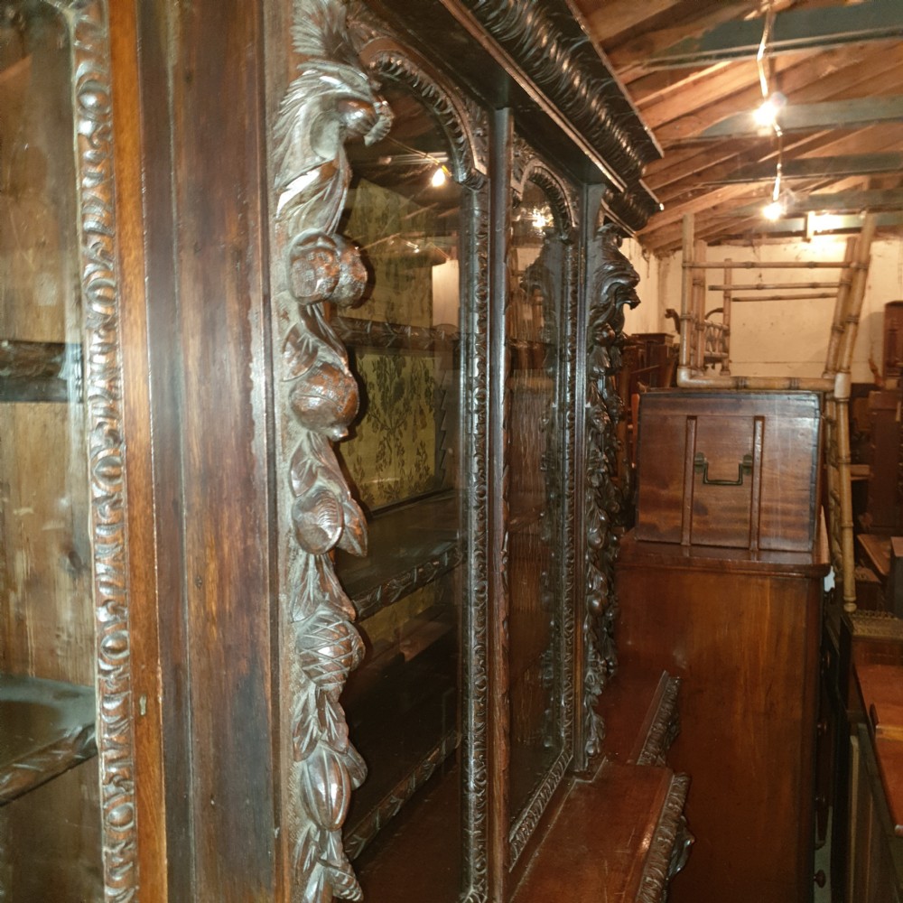 Good Victorian carved oak Green Man breakfront bookcase.  View VI