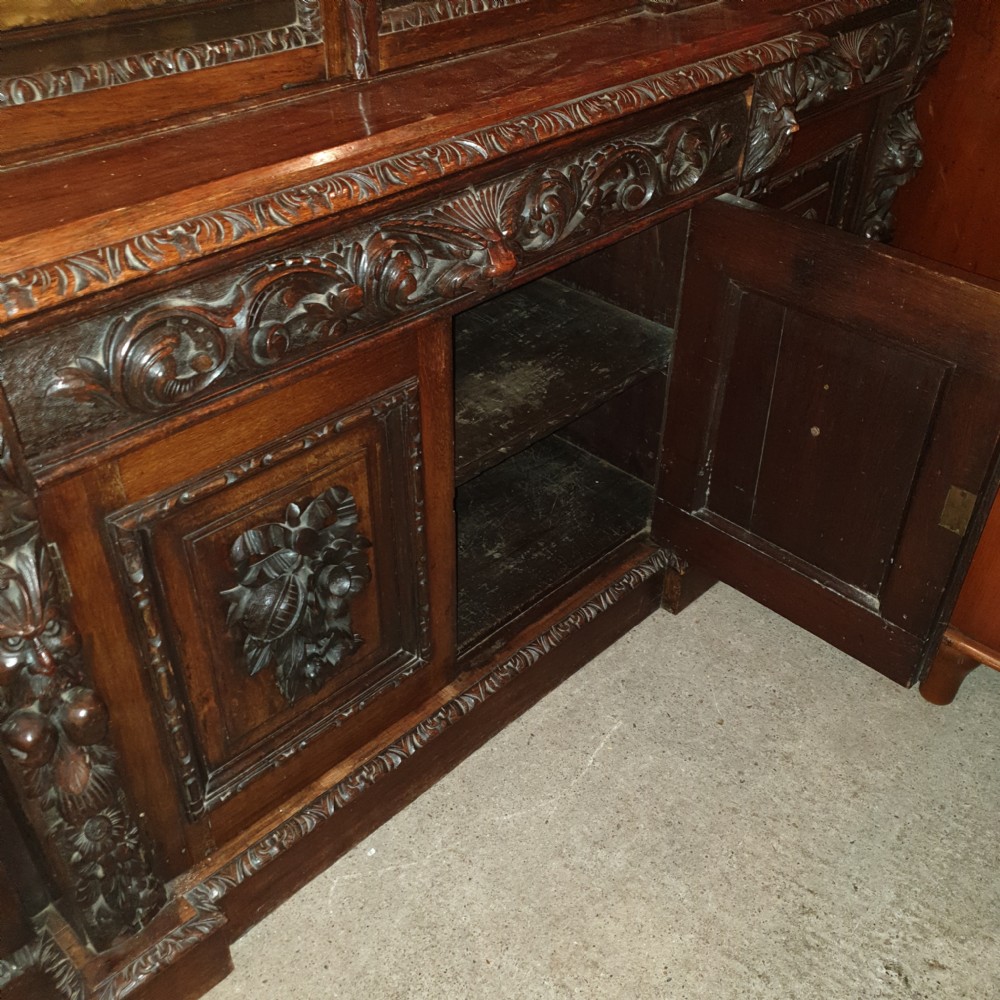 Good Victorian carved oak Green Man breakfront bookcase.  View VII