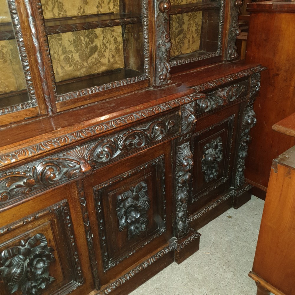 Good Victorian carved oak Green Man breakfront bookcase.  View VIII