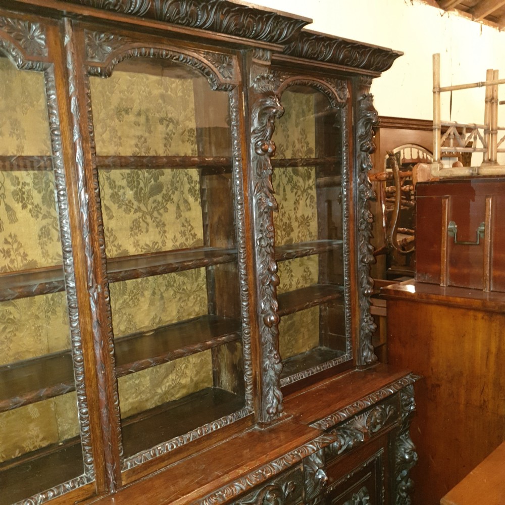 Good Victorian carved oak Green Man breakfront bookcase.  View IX