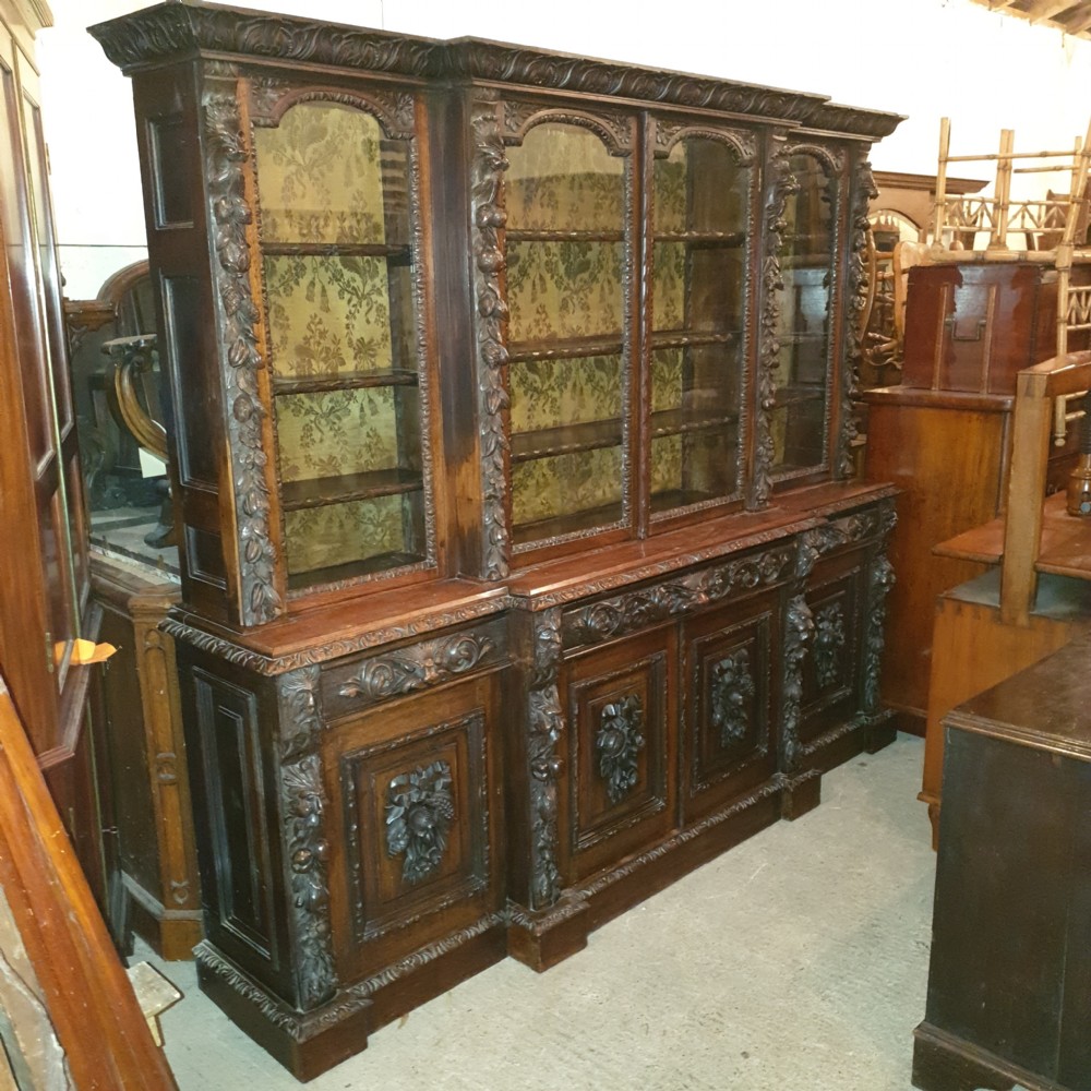 Good Victorian carved oak Green Man breakfront bookcase.  View XI