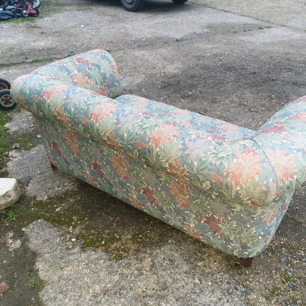 Edwardian upholstered Chesterfield sofa with drop arm. View IV
