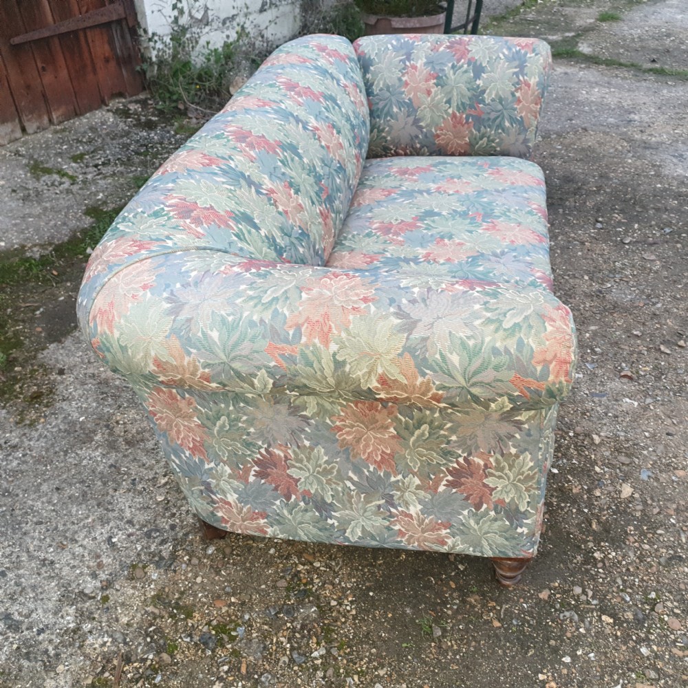 Edwardian upholstered Chesterfield sofa with drop arm. View VI