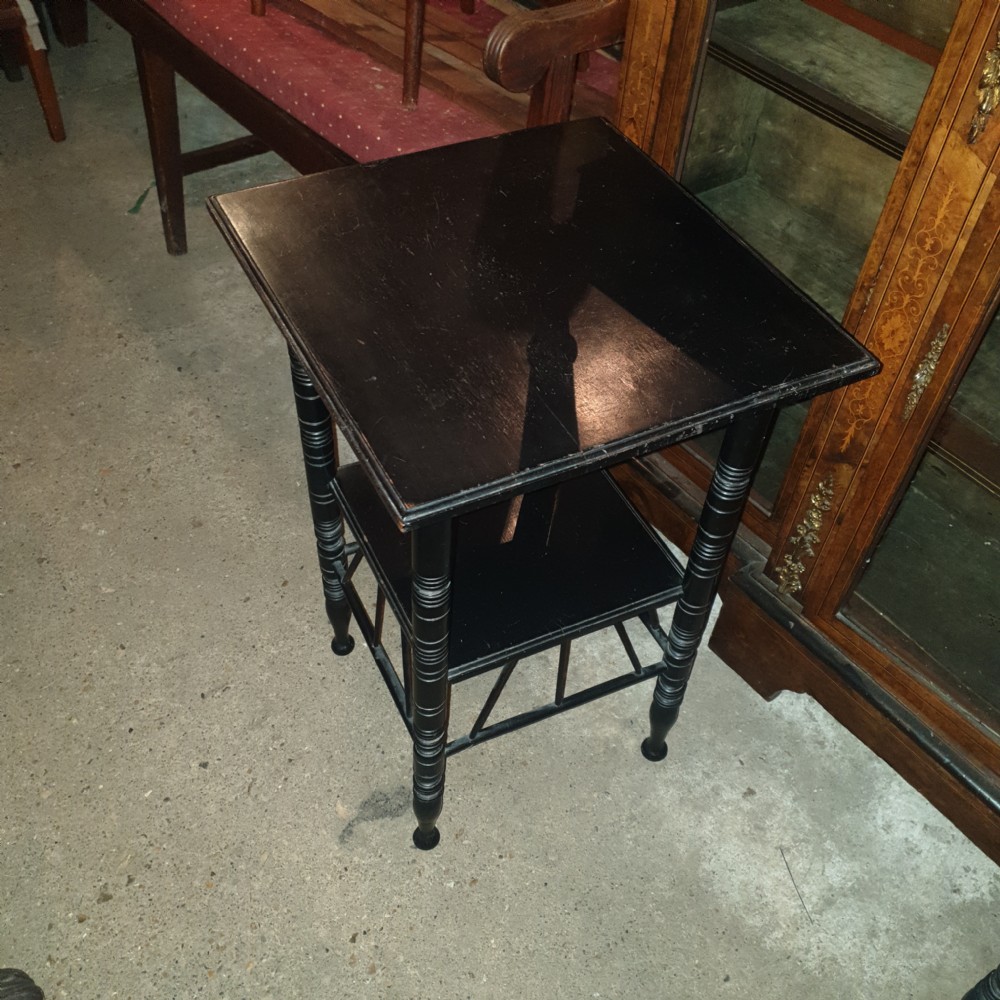 Close pair of ebonised occasional tables in the of E W Godwin.  View III