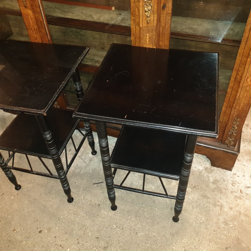 Close pair of ebonised occasional tables in the of E W Godwin.  View VII