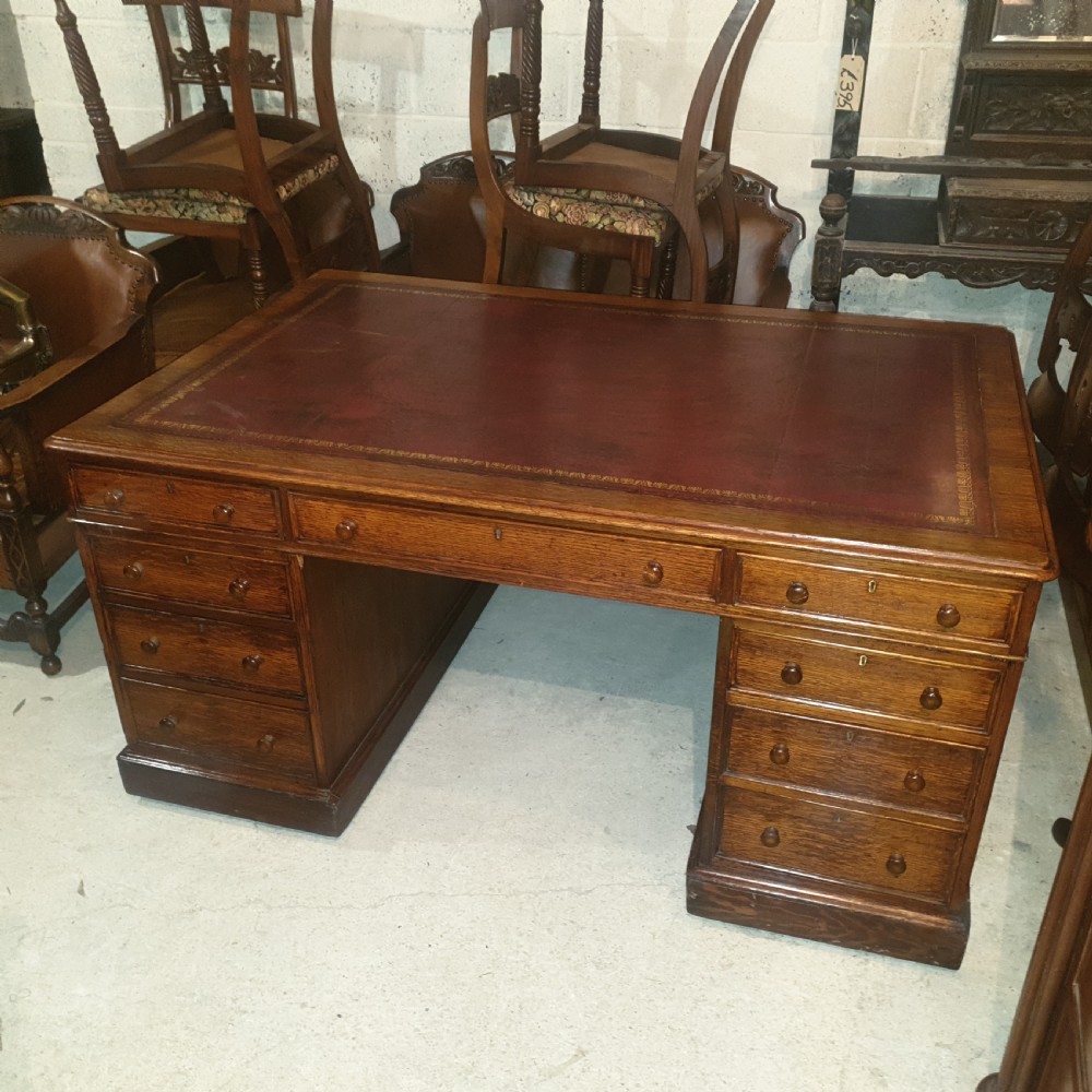 Late Victorian oak pedestal partners desk 