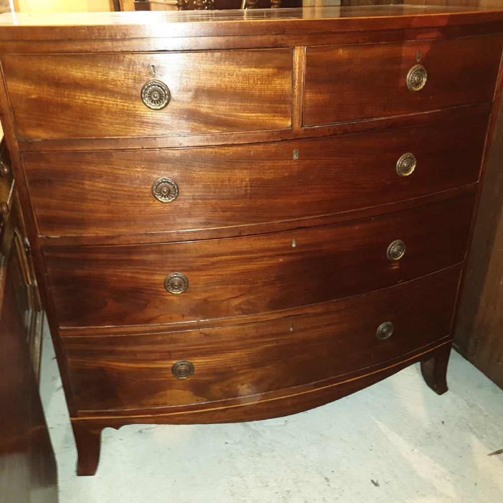 Late Georgian mahogany bow front chest of drawers.  View II