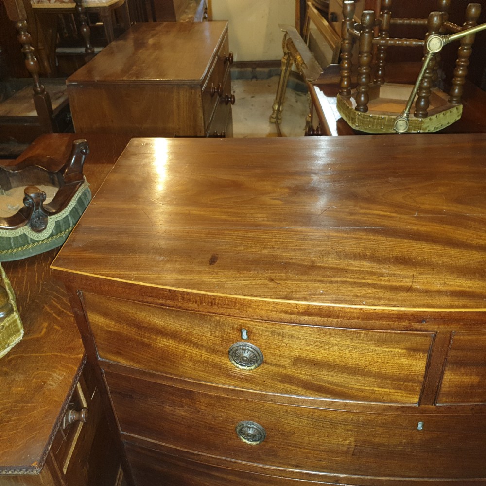 Late Georgian mahogany bow front chest of drawers.  View IV