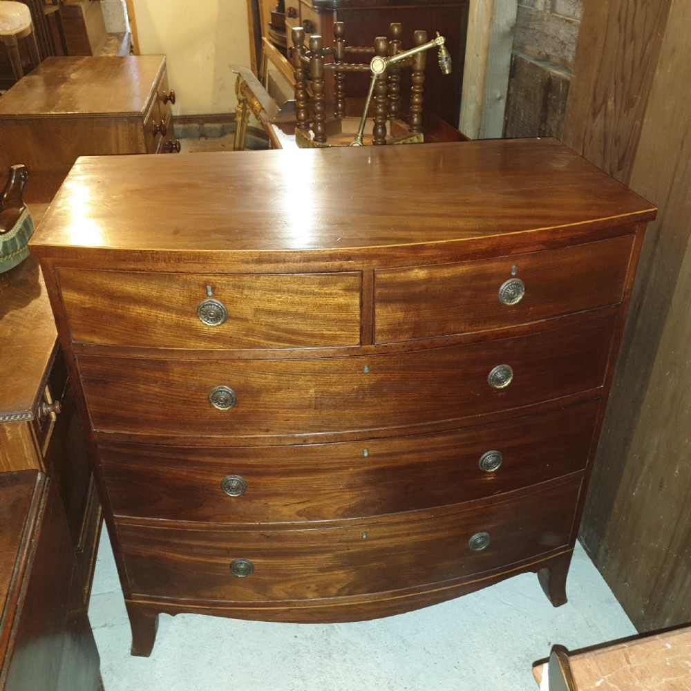 Late Georgian mahogany bow front chest of drawers.  View VI