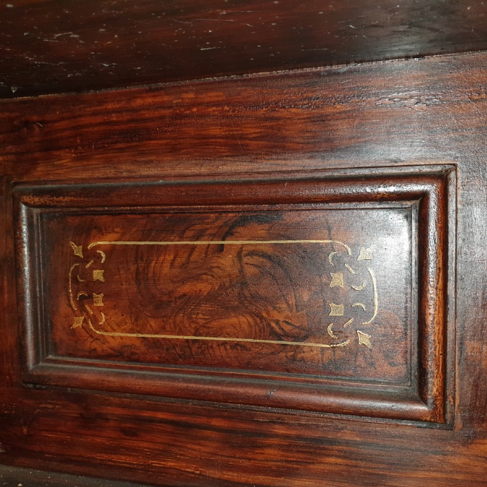 A dark brown Scottish Victorian dresser featuring a carved cresting rail, upper shelves, two drawers, and twin cupboard doors with a scumbled faux-grain finish. View II