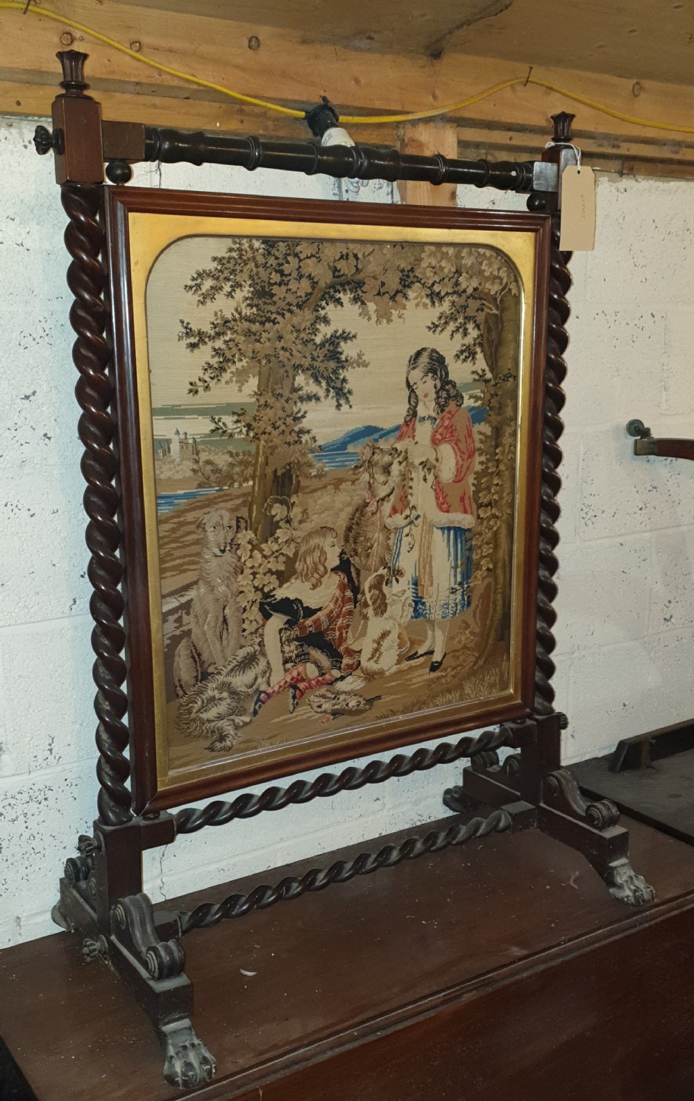 Good Mid 19th century rosewood firescreen with original woolwork. 