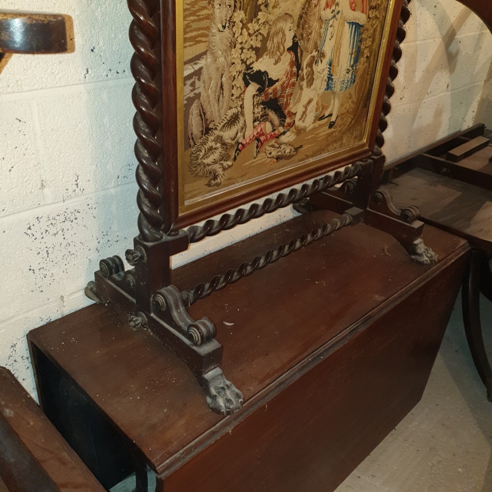 Good Mid 19th century rosewood firescreen with original woolwork.  View II