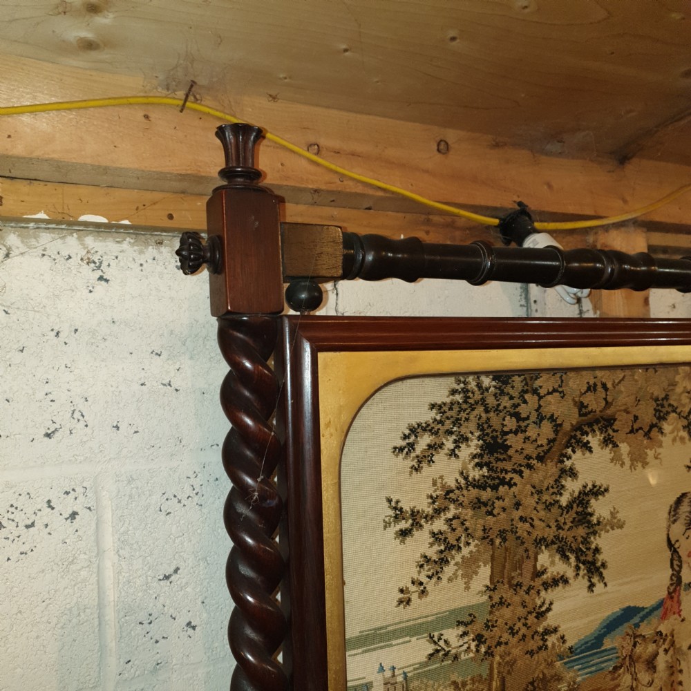 Good Mid 19th century rosewood firescreen with original woolwork.  View III