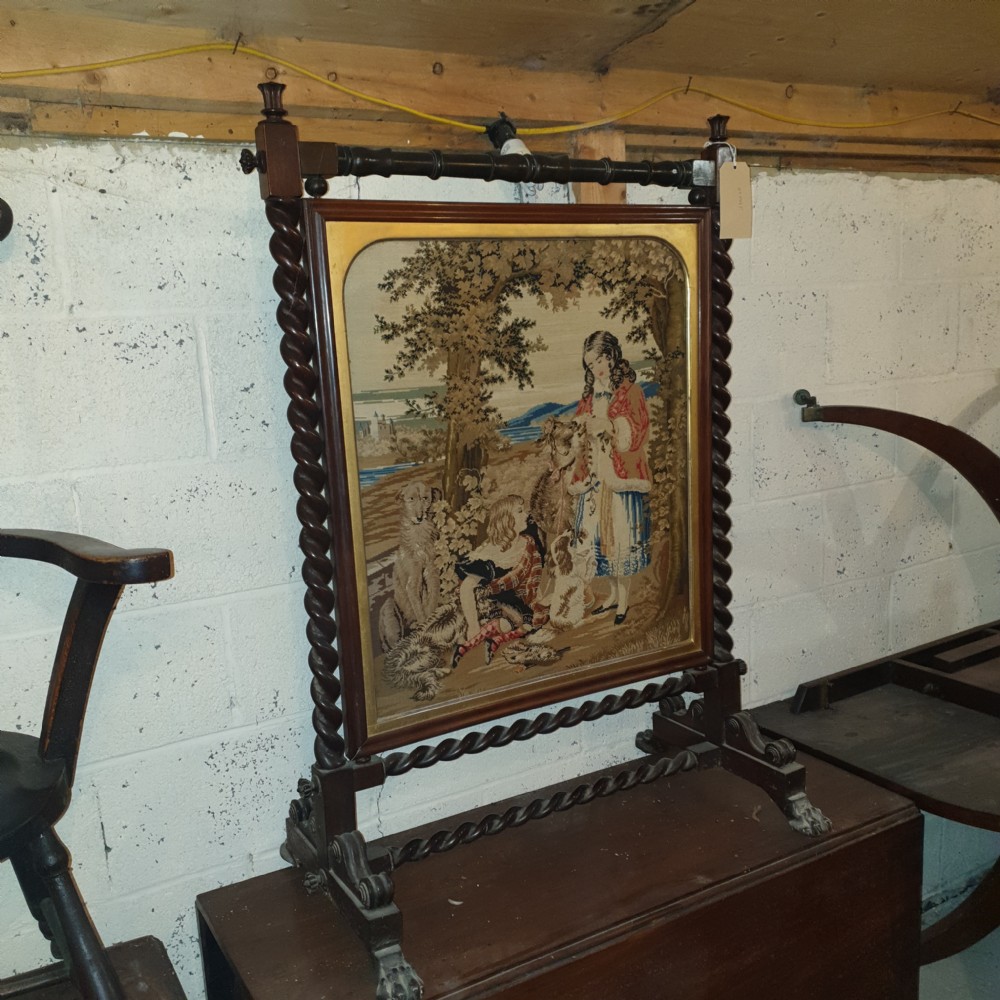 Good Mid 19th century rosewood firescreen with original woolwork.  View VI