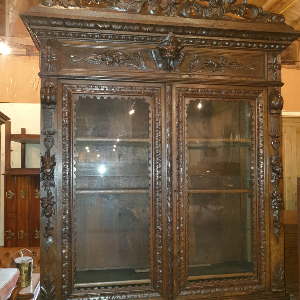 Large Victorian carved oak bookcase cabinet.  View VII