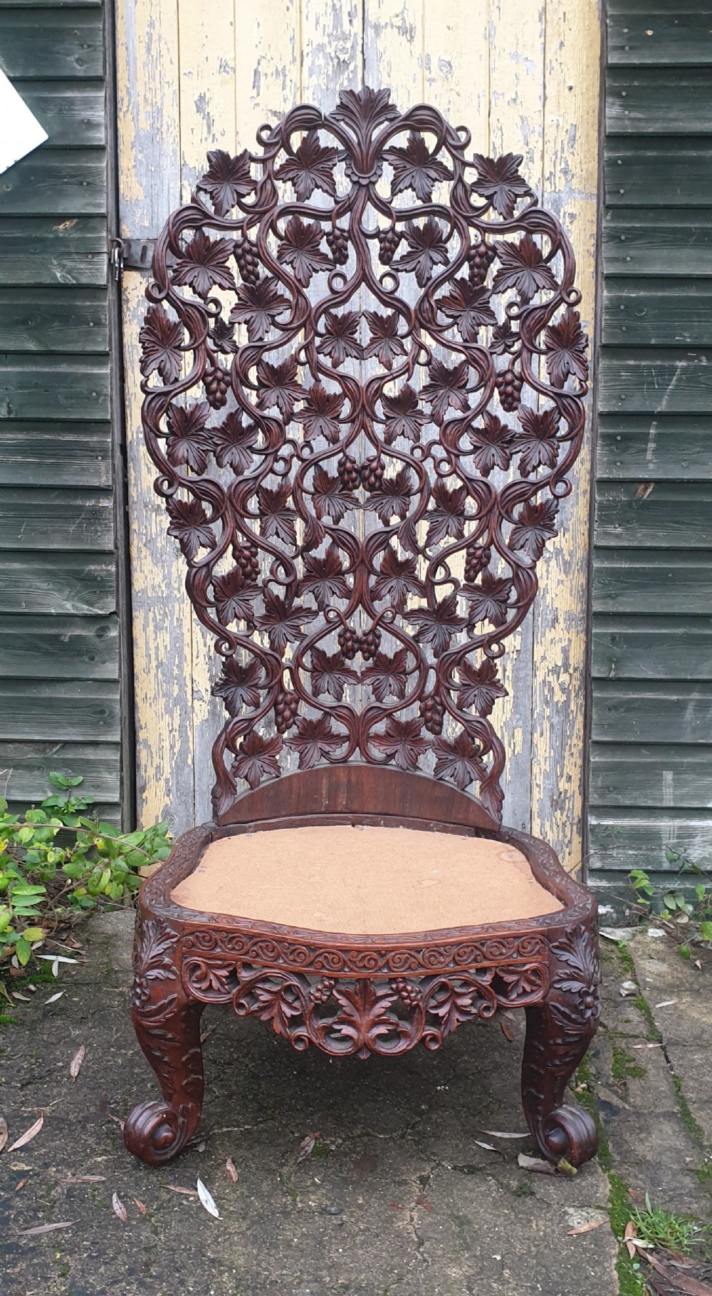 Ornate carved Burmese high back chair