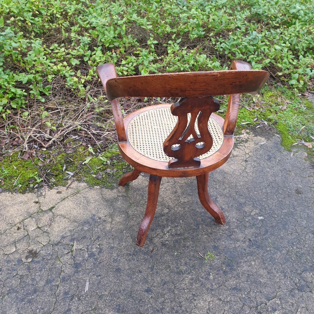 Victorian oak cane seat revolving desk armchair  View II