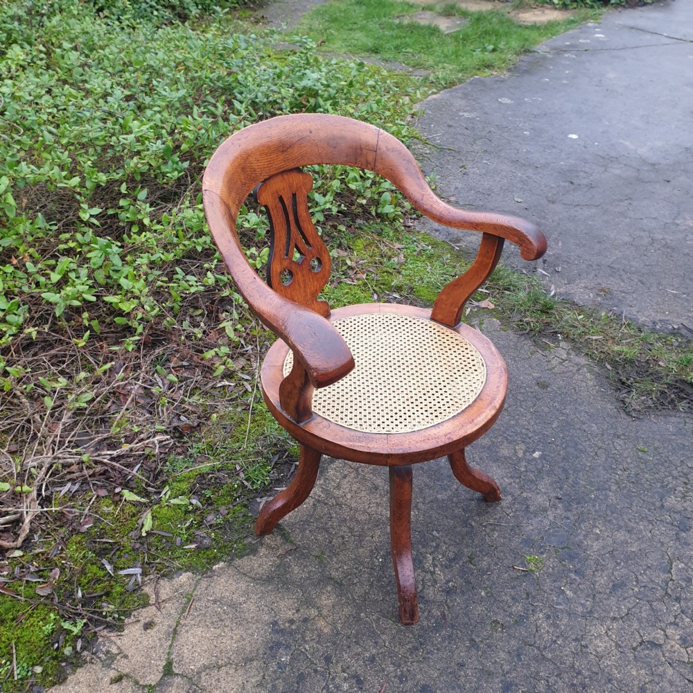 Victorian oak cane seat revolving desk armchair  View III
