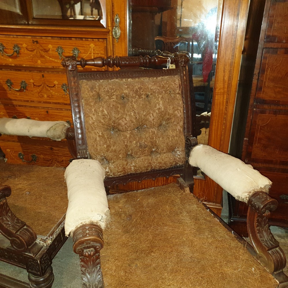 Pair of Victorian carved walnut library armchairs.  View III