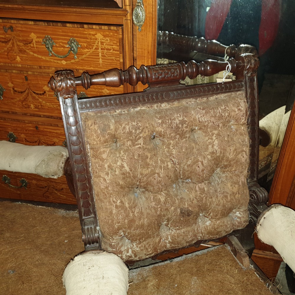 Pair of Victorian carved walnut library armchairs.  View V