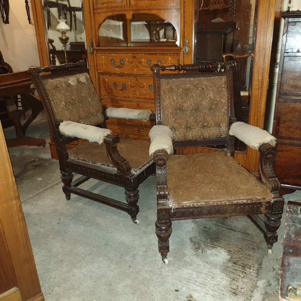 Pair of Victorian carved walnut library armchairs.  View VII
