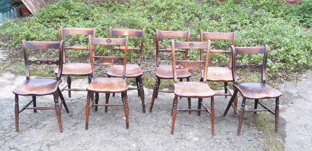 Harlequin set of 8 19th century Windsor farmhouse kitchen chairs.