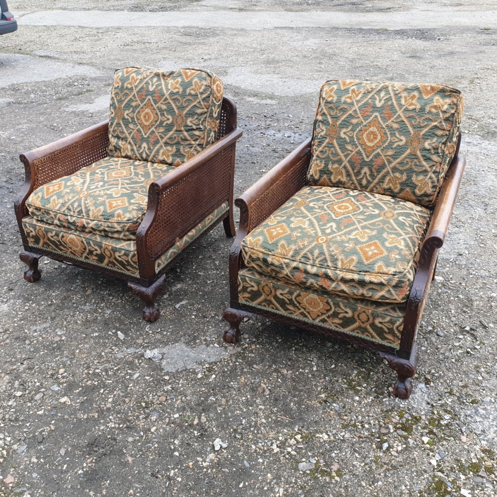 Pair of Edwardian country house bergere armchairs 