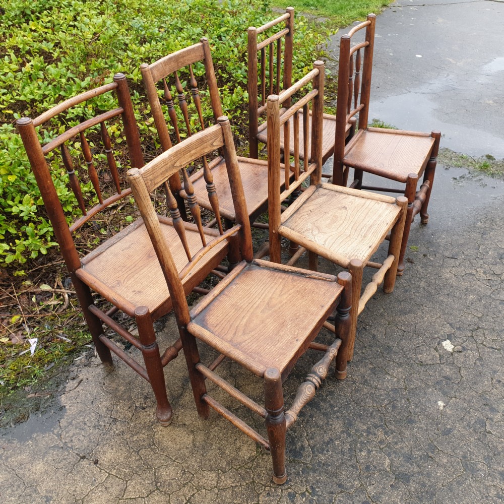 Harlequin set of early 19th century wood seat country chairs. View V
