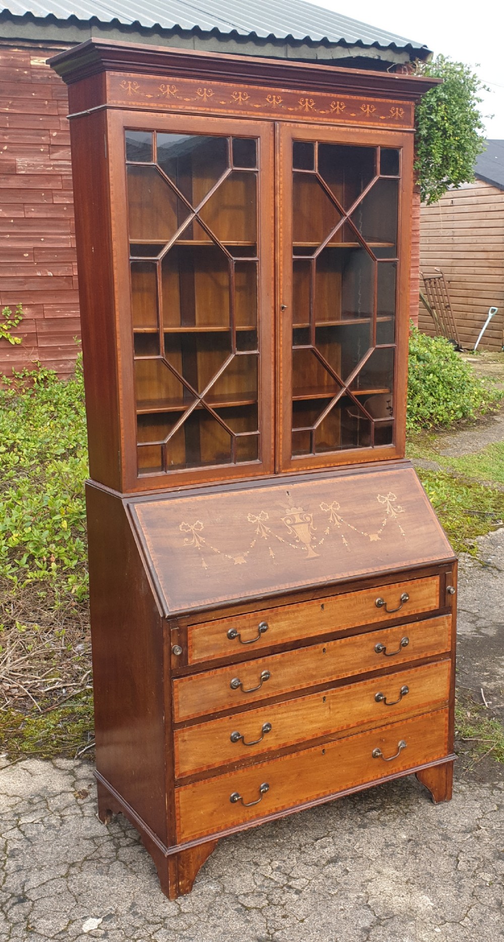Edwardian inlaid mahogany bureau bookcase .