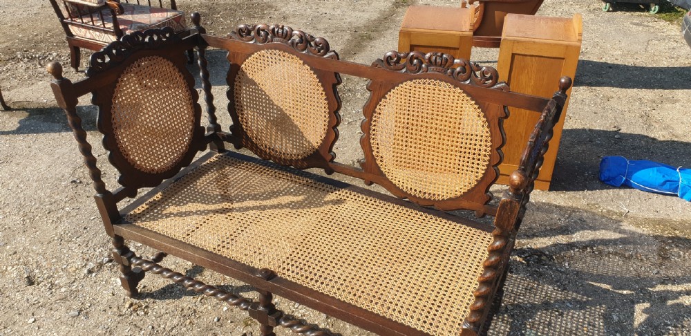 Carved oak and caned hall seat.  View II