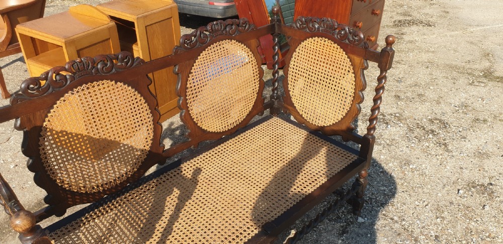 Carved oak and caned hall seat.  View III