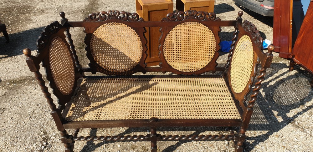 Carved oak and caned hall seat.  View V