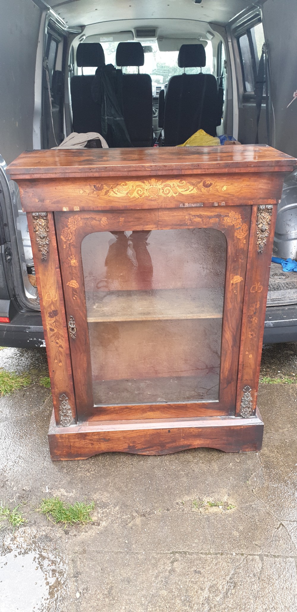 A Victorian walnut pier cabinet featuring floral marquetry inlay, a single glazed glass door, and gilt metal mounts on the side pilasters. View III