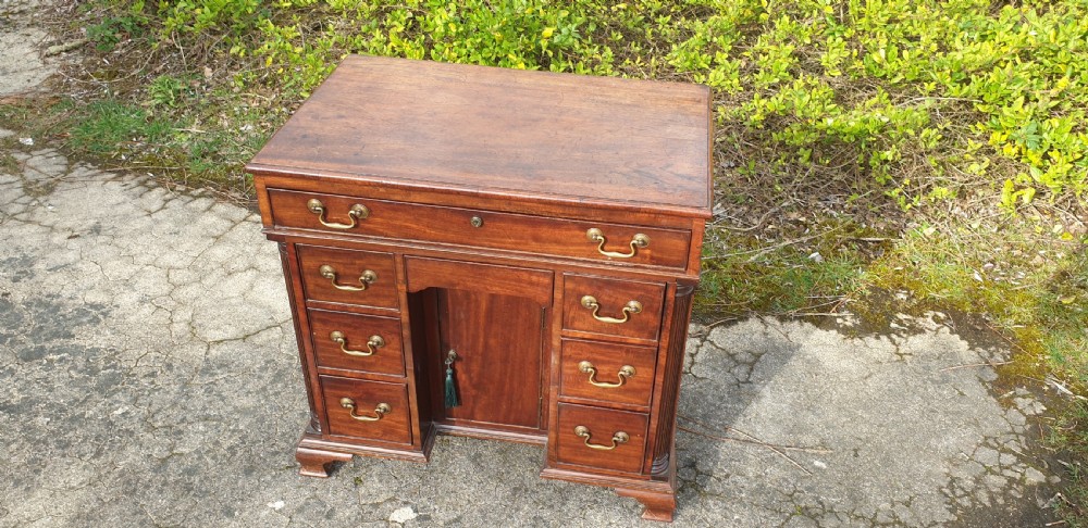 Small 19th century mahogany kneehole writing desk.  View V