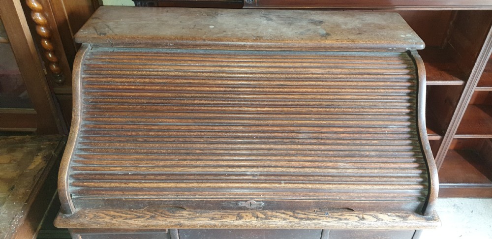 Small oak tambour roll top pedestal desk. View III
