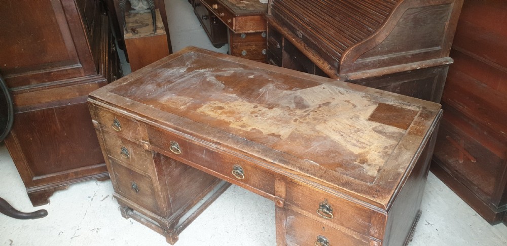 1920s oak kneehole pedestal desk.  View V