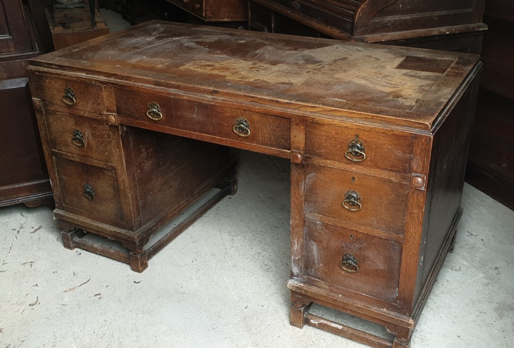 1920s oak kneehole pedestal desk. 