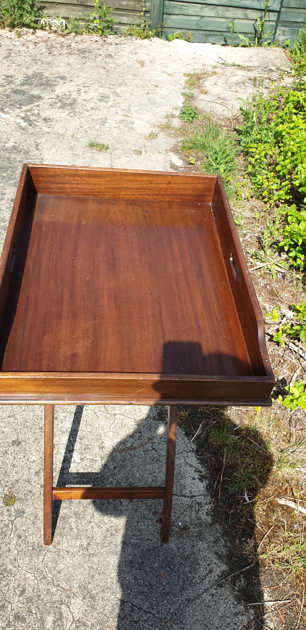 Late Victorian mahogany butlers tray on folding stand.  View IV