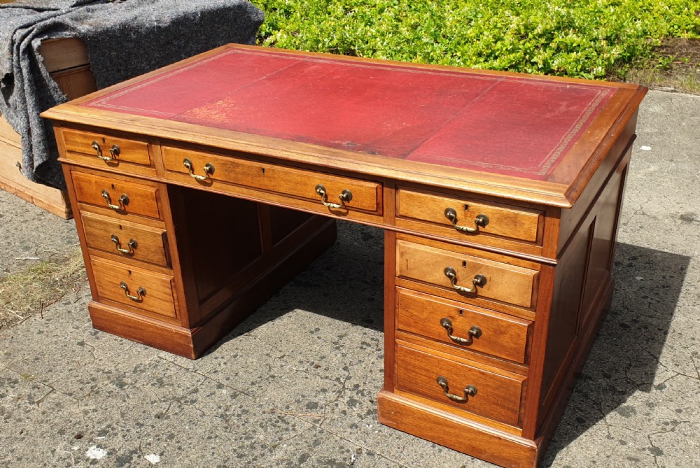 Panelled mahogany kneehole pedestal desk of larger size.