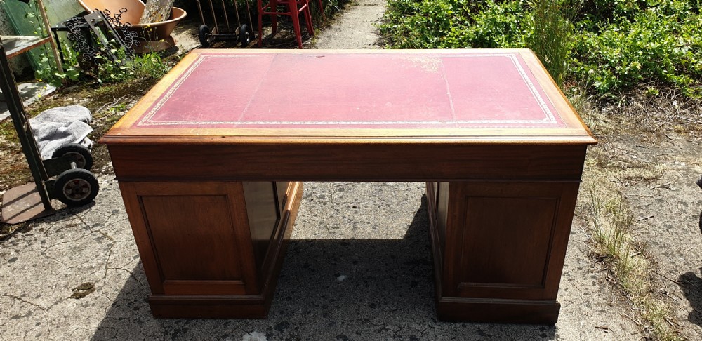 Panelled mahogany kneehole pedestal desk of larger size. View IV