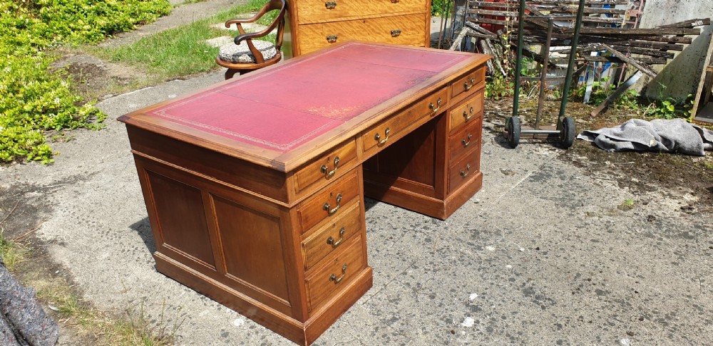 Panelled mahogany kneehole pedestal desk of larger size. View VI