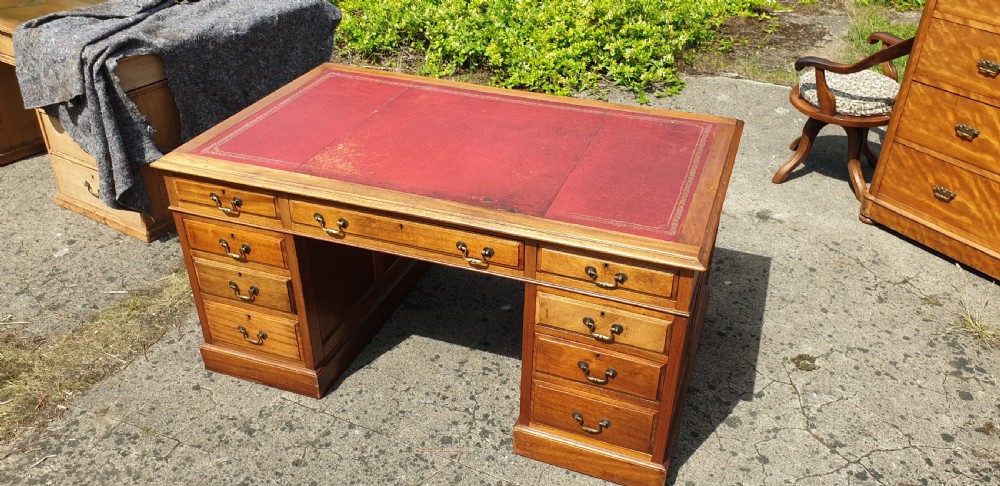 Panelled mahogany kneehole pedestal desk of larger size. View VII