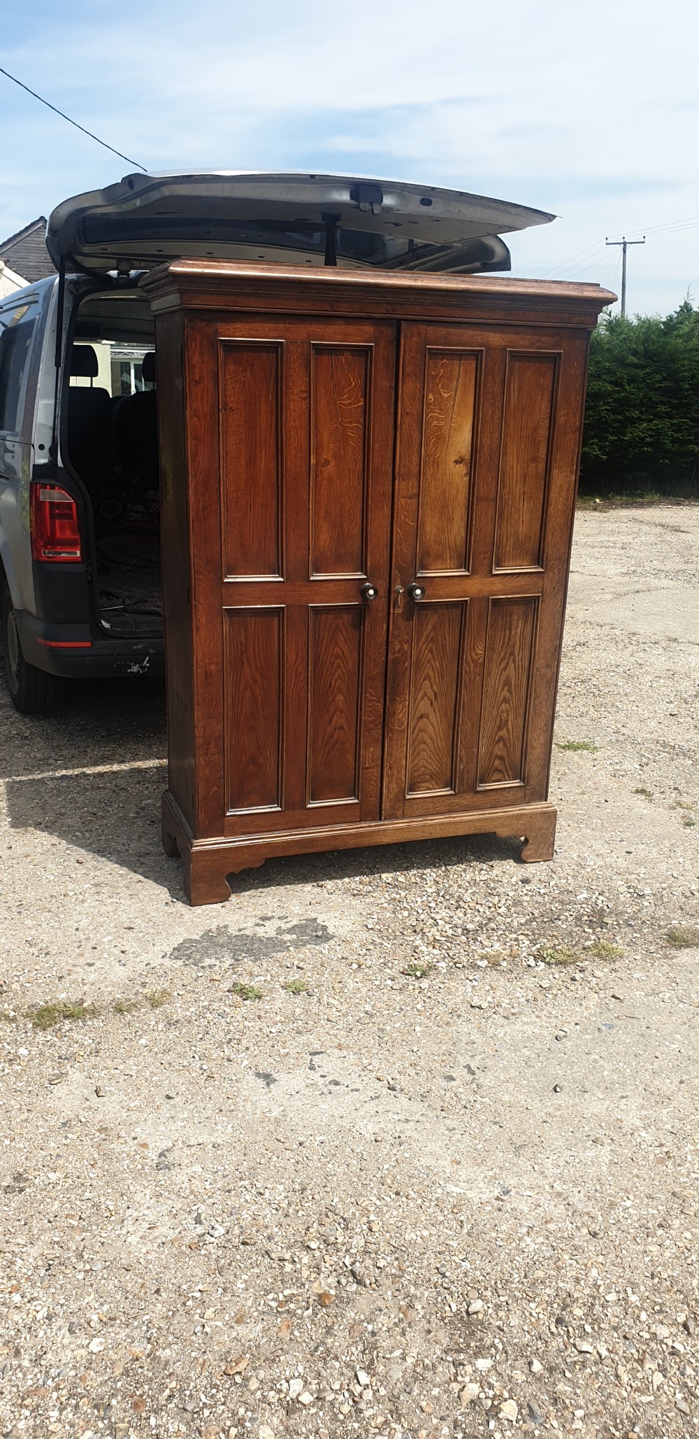 Useful early Victorian century panelled oak cupboard.  View IV