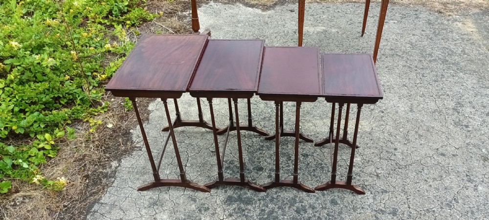 Nest of 4 Edwardian mahogany tables. View II