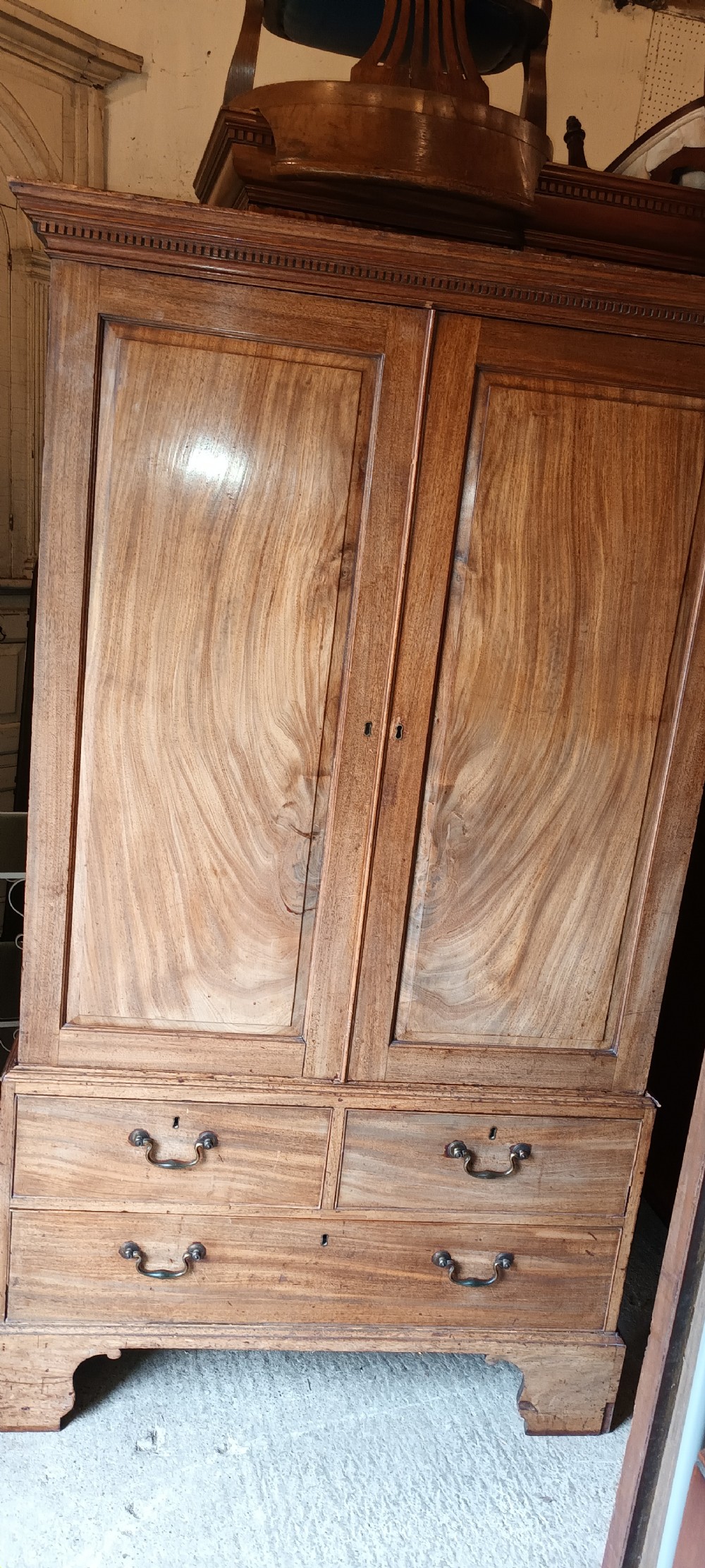 Late Georgian mahogany housekeepers linen press cupboard . View II